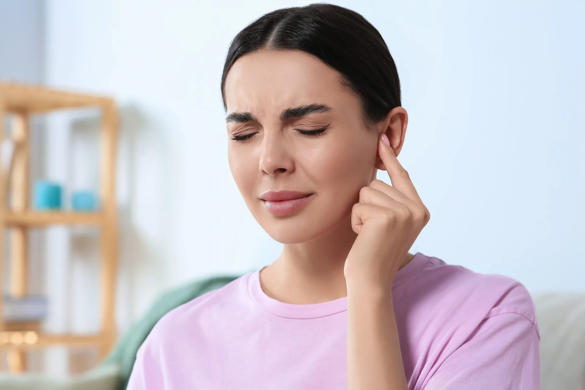 young-woman-suffering-ear-pain-home